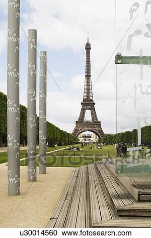 Stock Image - Columns with tower in the background, Eiffel Tower, Paris, France. Fotosearch