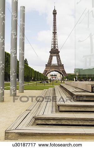 Columns with tower in the background, Eiffel Tower, Champ De Mars, Paris, France View Large Photo Image Stock Photo - Columns with tower in the background, Eiffel Tower, Champ De Mars, Paris, France. Fotosearch