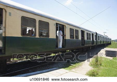 Stock Photograph - Commuters in a train, Kanchipuram, Tamil Nadu, India. Fotosearch