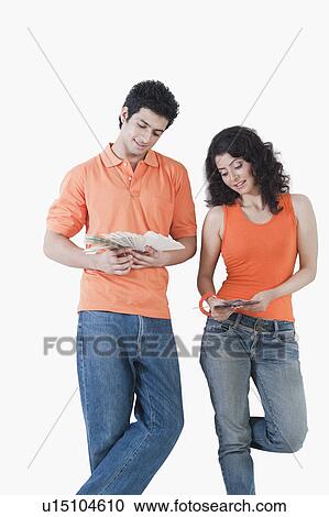 Couple choosing color from color swatches for their house View Large Photo Image Stock Image - Couple choosing color from color swatches for their house. Fotosearch