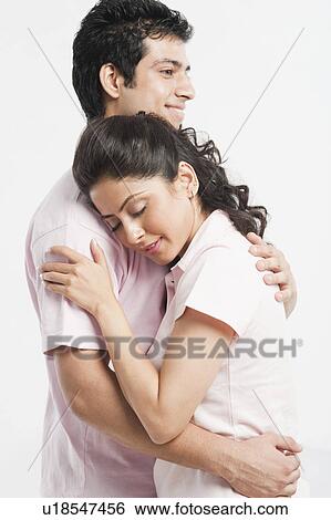 Couple embracing each other View Large Photo Image Stock Photograph - Couple embracing each other. Fotosearch