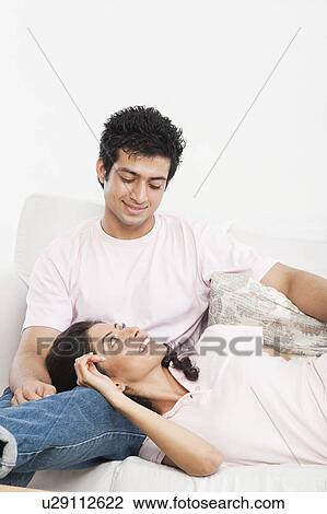 Couple on a couch View Large Photo Image Stock Image - Couple on a couch. Fotosearch