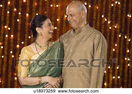 Stock Photo - Couple smiling at each other. Fotosearch