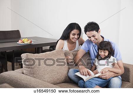 Couple teaching their daughter View Large Photo Image Stock Image - Couple teaching their daughter. Fotosearch