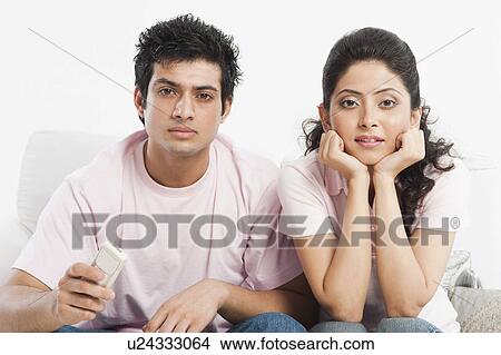 Picture - Couple watching television. Fotosearch