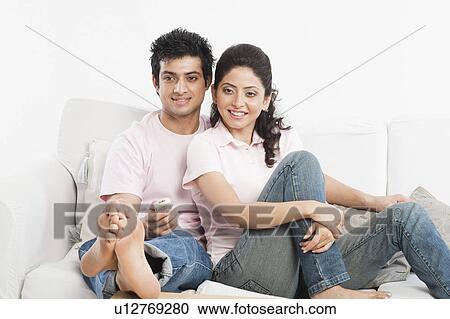 Couple watching television View Large Photo Image Stock Image - Couple watching television. Fotosearch