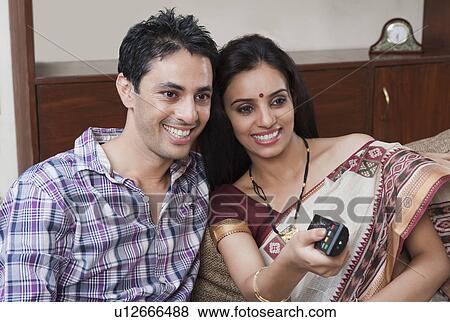 Stock Photo - Couple watching television. Fotosearch