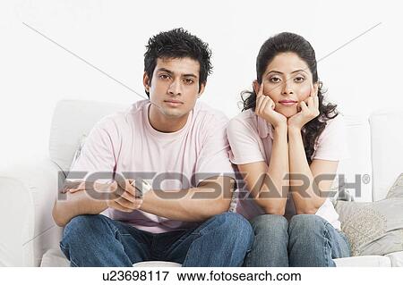 Stock Photo - Couple watching television. Fotosearch