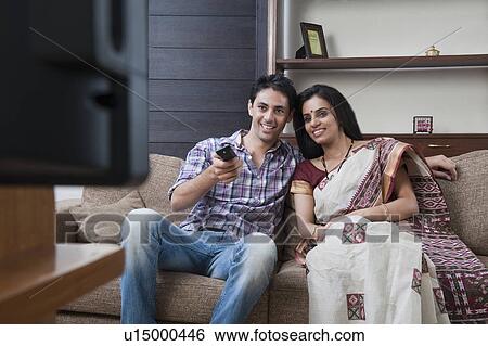 Stock Photograph - Couple watching television. Fotosearch