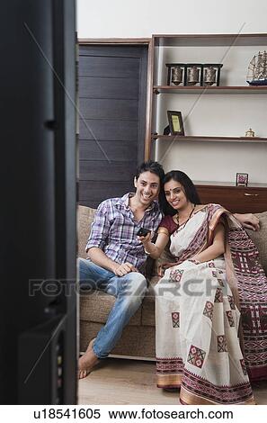 Couple watching television View Large Photo Image Stock Photography - Couple watching television. Fotosearch