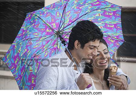 Couple with an ice cream View Large Photo Image Stock Photograph - Couple with an ice cream. Fotosearch