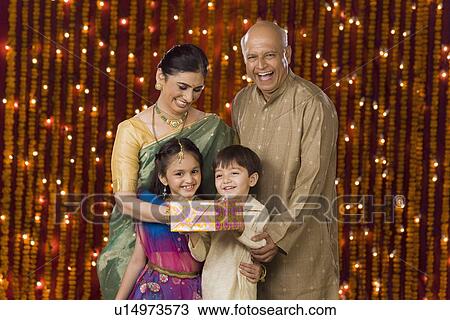 Stock Image - Couple with grandchildren. Fotosearch