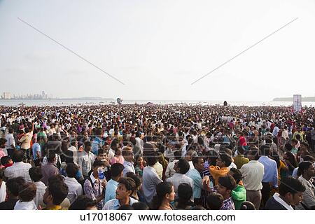 Crowd at religious procession during Ganpati visarjan ceremony, Mumbai, Maharashtra, India View Large Photo Image Stock Photo - Crowd at religious procession during Ganpati visarjan ceremony, Mumbai, Maharashtra, India. Fotosearch