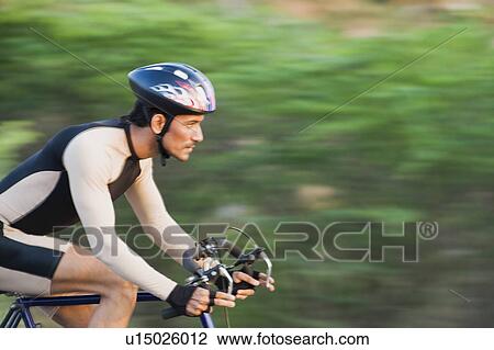 Cyclist on a racing bicycle View Large Photo Image Stock Image - Cyclist on a racing bicycle. Fotosearch