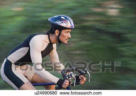 Cyclist on a racing bicycle View Large Photo Image Stock Image - Cyclist on a racing bicycle. Fotosearch