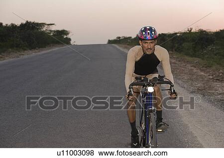 Stock Photo - Cyclist on a racing bicycle. Fotosearch
