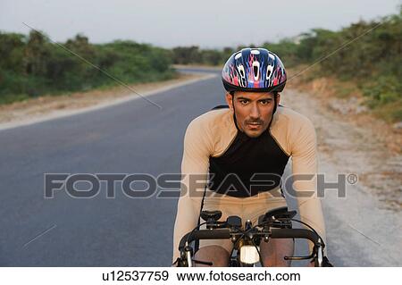 Stock Photo - Cyclist on a racing bicycle. Fotosearch