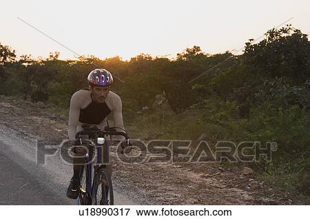 Stock Photo - Cyclist on a racing bicycle. Fotosearch