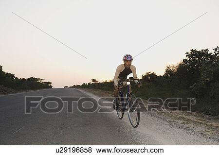 Stock Photo - Cyclist on a racing bicycle. Fotosearch