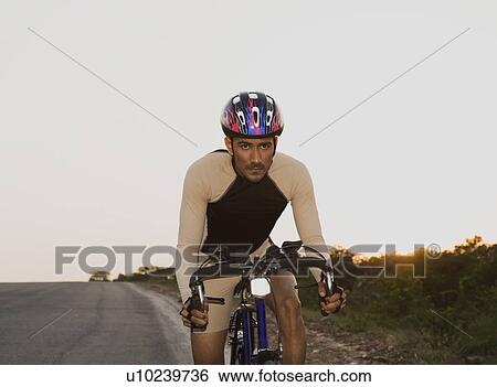 Stock Photograph - Cyclist on a racing bicycle. Fotosearch