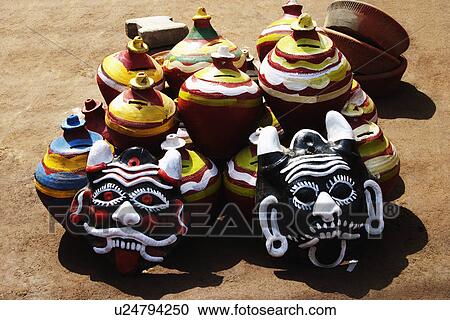 Stock Image - Decorative pots with nazar battus at a market stall, Delhi, India. Fotosearch