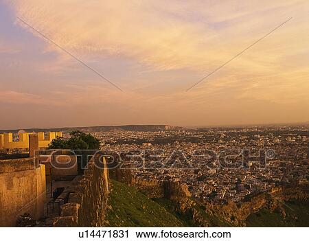 Stock Image - Defensive wall of a fort with cityscape, Nahargarh Fort, Jaipur, Rajasthan, India. Fotosearch