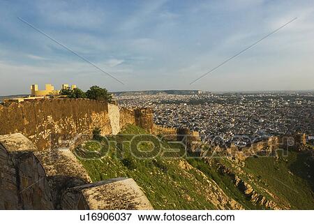 Stock Photo - Defensive wall of a fort with cityscape, Nahargarh Fort, Jaipur, Rajasthan, India. Fotosearch