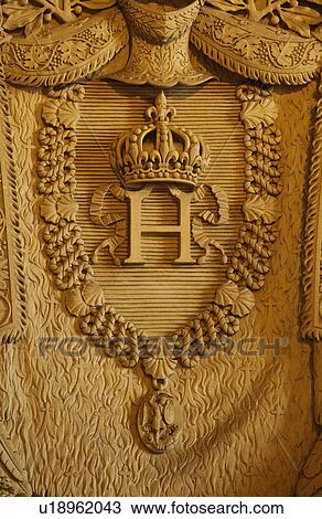 Stock Image - Details of carved crown and necklace in a museum, Musee du Louvre, Paris, France. Fotosearch