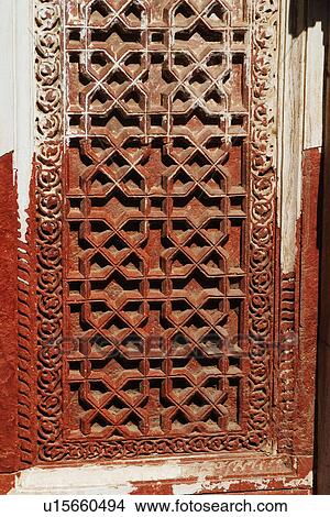 Picture - Details of carvings on the window, Qutub Minar, New Delhi, India. Fotosearch