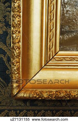 Stock Photography - Details of the golden frame of a painting in a museum, Musee du Louvre, Paris, France. Fotosearch