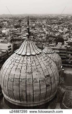 Stock Photography - Domes of a mosque with cityscape, Jama Masjid, Delhi, India. Fotosearch