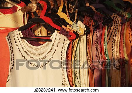 Dresses hanging at a clothing store, Goa, India View Large Photo Image Stock Image - Dresses hanging at a clothing store, Goa, India. Fotosearch