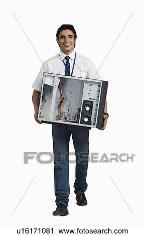 Engineering student carrying a computer cabinet View Large Photo Image Stock Image - Engineering student carrying a computer cabinet. Fotosearch