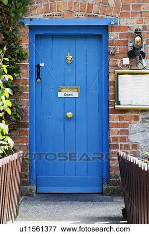 Stock Photo - Entrance of a restaurant, The Blue Door Restaurant, Adare, County Limerick, Republic of Ireland. Fotosearch