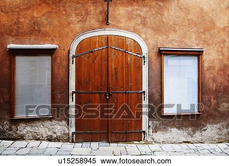 Stock Photography - Facade of an orange building, Cesky Krumlov, South Bohemian Region, Czech Republic. Fotosearch