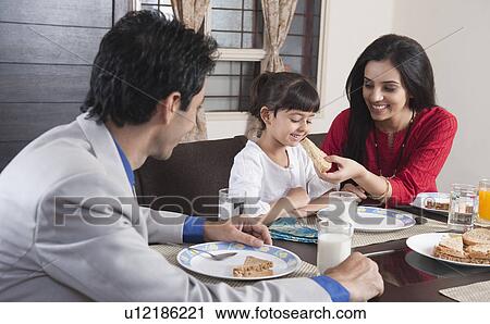Family at a breakfast table View Large Photo Image Stock Image - Family at a breakfast table. Fotosearch