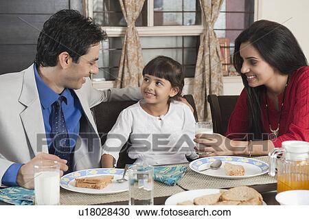 Stock Image - Family at a breakfast table. Fotosearch