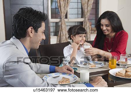 Family at a breakfast table View Large Photo Image Stock Photo - Family at a breakfast table. Fotosearch