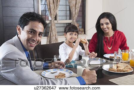 Family at a breakfast table View Large Photo Image Stock Photo - Family at a breakfast table. Fotosearch
