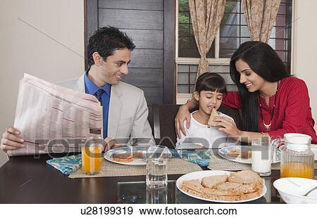 Stock Photo - Family at a breakfast table. Fotosearch