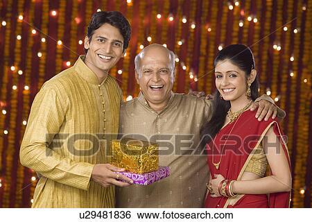 Family at Diwali occasion smiling View Large Photo Image Stock Photograph - Family at Diwali occasion smiling. Fotosearch