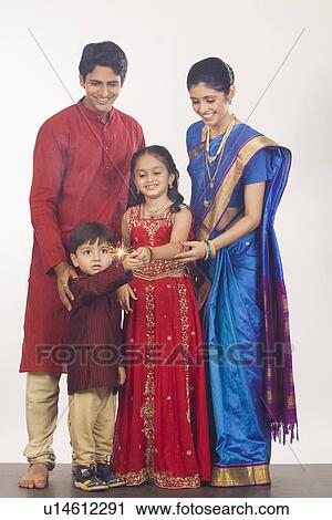 Family celebrating Diwali View Large Photo Image Stock Image - Family celebrating Diwali. Fotosearch