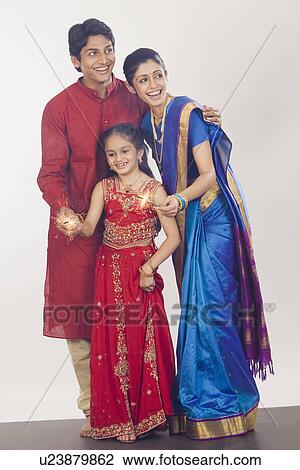 Family celebrating Diwali View Large Photo Image Stock Image - Family celebrating Diwali. Fotosearch