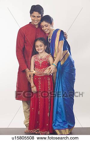 Family celebrating Diwali View Large Photo Image Stock Photo - Family celebrating Diwali. Fotosearch