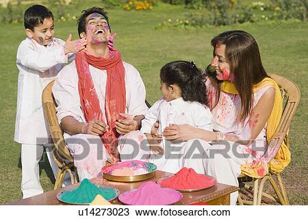 Family celebrating Holi in a garden View Large Photo Image Stock Image - Family celebrating Holi in a garden. Fotosearch