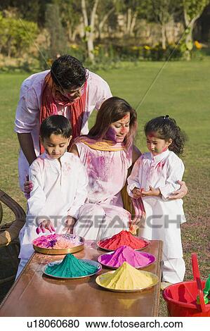 Family celebrating Holi in a garden View Large Photo Image Stock Image - Family celebrating Holi in a garden. Fotosearch