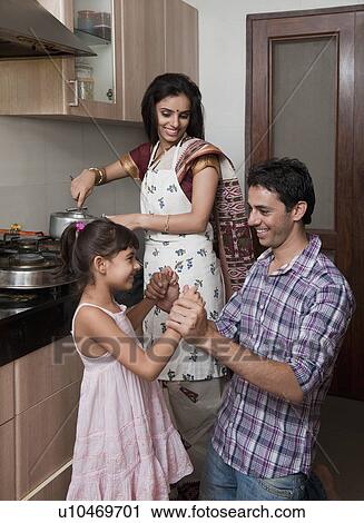 Stock Image - Family in the kitchen. Fotosearch