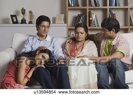 Family looking sad View Large Photo Image Picture - Family looking sad. Fotosearch