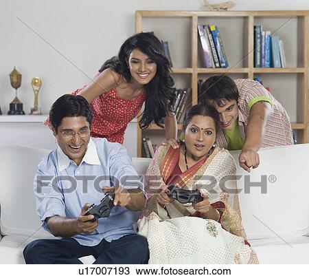 Family playing video game View Large Photo Image Stock Image - Family playing video game. Fotosearch