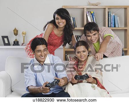 Family playing video game View Large Photo Image Stock Image - Family playing video game. Fotosearch